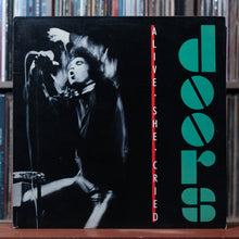Load image into Gallery viewer, The Doors - Alive, She Cried - PROMO W/ PRESS RELEASE &amp; PHOTO - 1983 Elektra, VG+/VG+ 1
