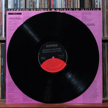 Load image into Gallery viewer, Jackson Browne - World In Motion - 1989 Elektra, VG/EX 4
